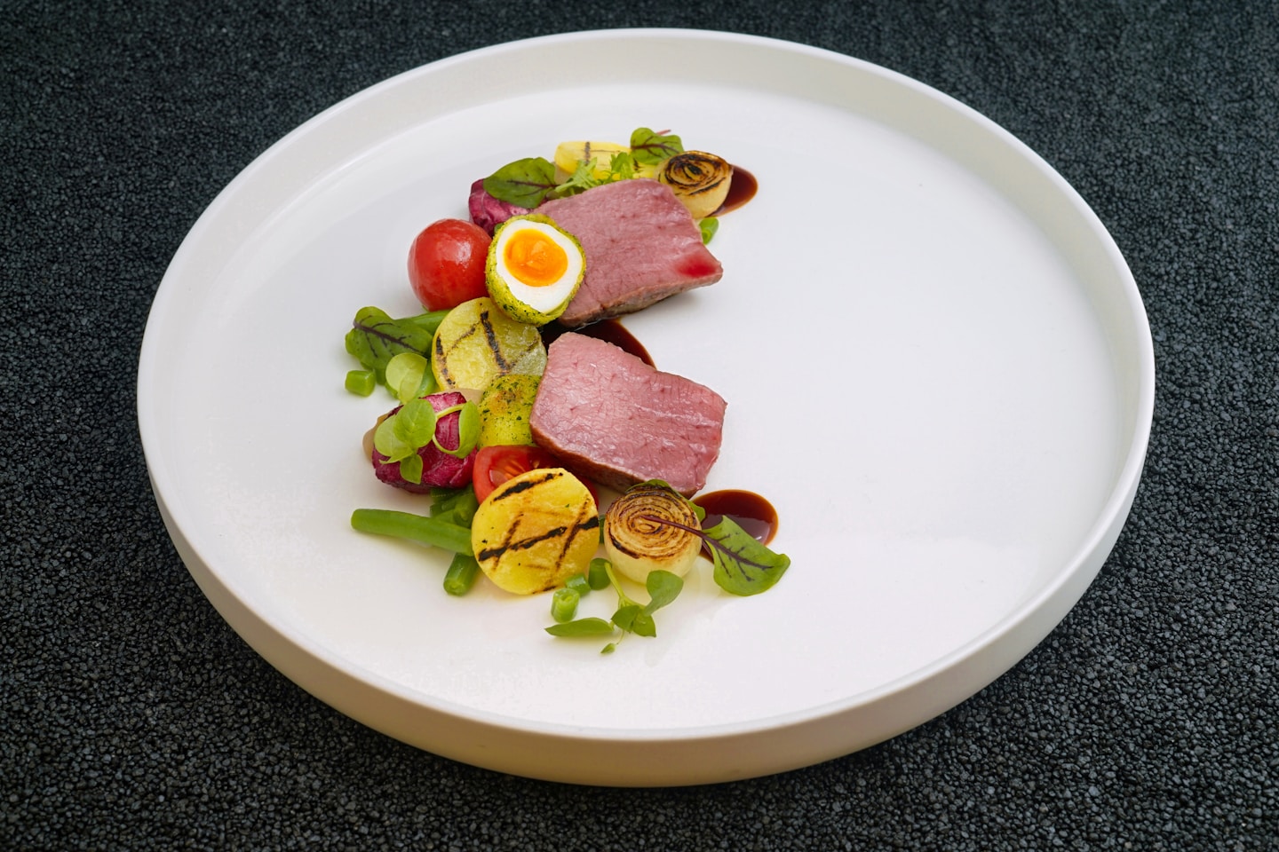 cooked food and vegetables on white plate