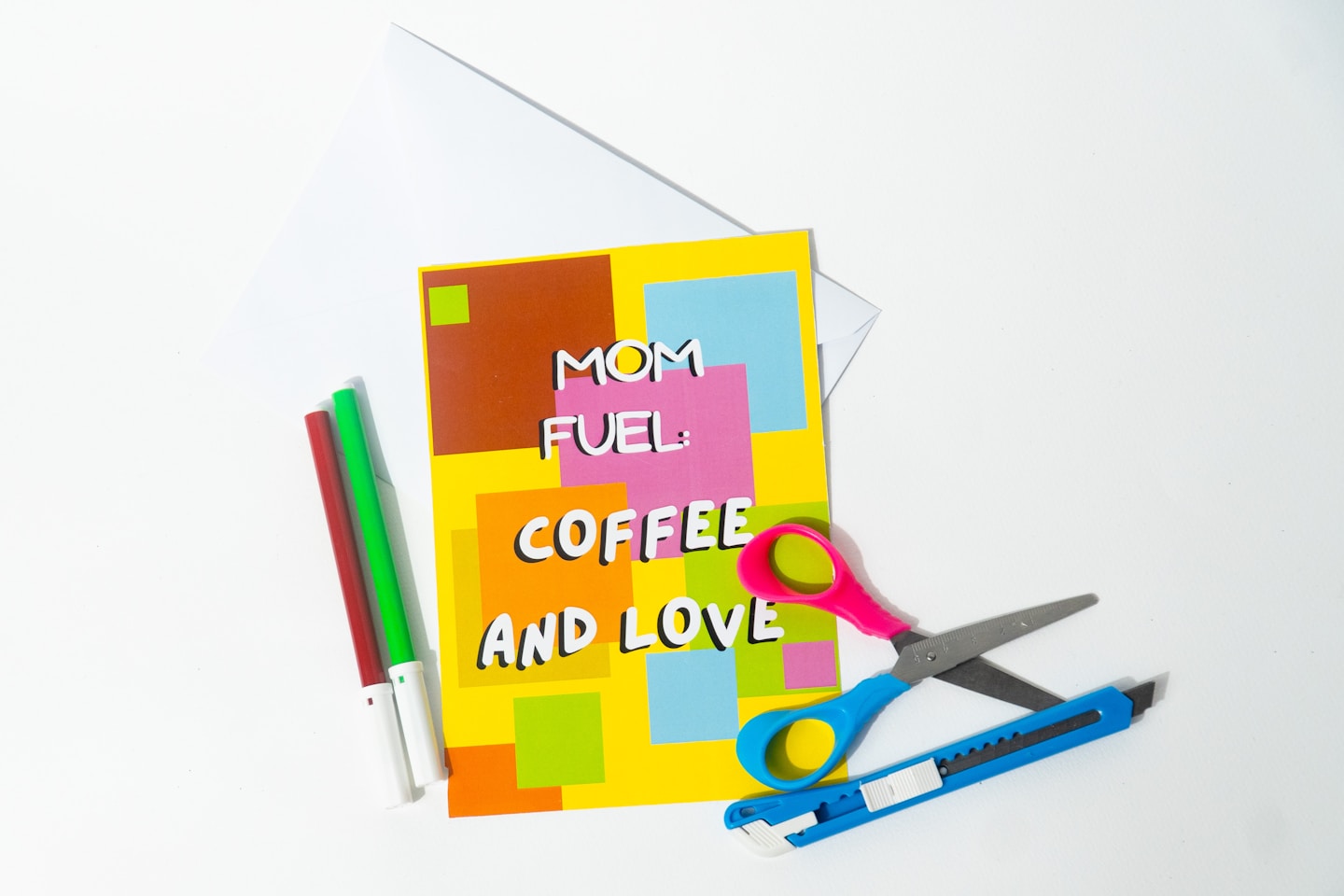 Card with "mom fuel, coffee and love" and craft supplies.