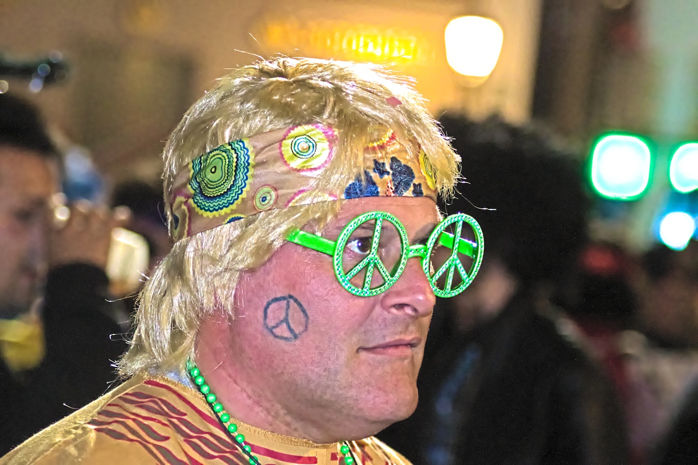 a man with a peace sign painted on his face